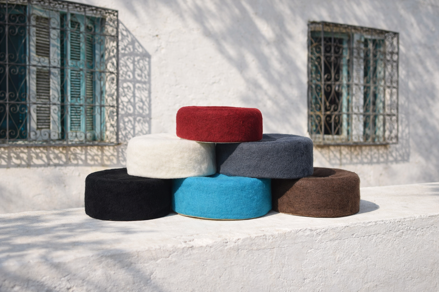 chechia_stacked_on_a_roof_with_windows_in_the_background.png